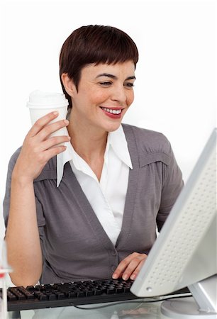 simsearch:400-04188263,k - Female executive drinking a coffee at her desk against a white background Foto de stock - Super Valor sin royalties y Suscripción, Código: 400-04188052