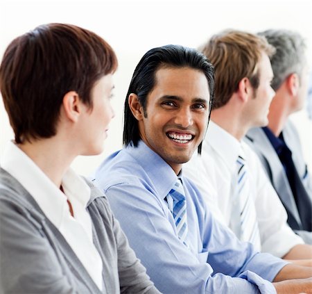 International business people sitting in a row in a meeting Stock Photo - Budget Royalty-Free & Subscription, Code: 400-04188108