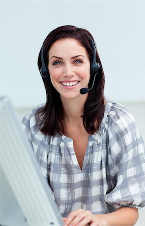 simsearch:400-04188205,k - Confident businesswoman with headset on working at a computer in a call-center Stock Photo - Budget Royalty-Free & Subscription, Code: 400-04188207