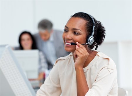 simsearch:400-04472832,k - Positive business partners with headset on working in a call center Stock Photo - Budget Royalty-Free & Subscription, Code: 400-04188208
