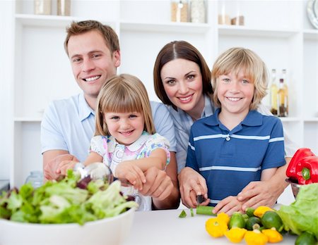 simsearch:400-04206231,k - Cheerful young family cooking together in the kitchen Stock Photo - Budget Royalty-Free & Subscription, Code: 400-04188227