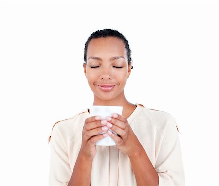 simsearch:400-04188263,k - Beautiful businesswoman holding a drinking cup against a white background Foto de stock - Super Valor sin royalties y Suscripción, Código: 400-04188263