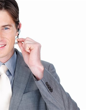 simsearch:400-04119293,k - Close-up of a businessman talking on a headset isolated on a white background Fotografie stock - Microstock e Abbonamento, Codice: 400-04188278