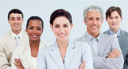 simsearch:6109-06002735,k - International business people standing with folded arms smiling at the camera Stock Photo - Budget Royalty-Free & Subscription, Code: 400-04188475