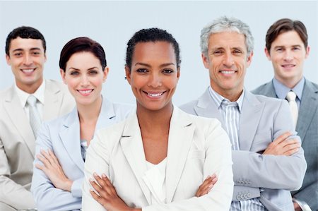 simsearch:6109-06002735,k - Diverse business people standing with folded arms smiling at the camera Stock Photo - Budget Royalty-Free & Subscription, Code: 400-04188476