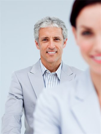 simsearch:6109-06002735,k - Mature businessman smiling at the camera. Business concept. Stock Photo - Budget Royalty-Free & Subscription, Code: 400-04188479