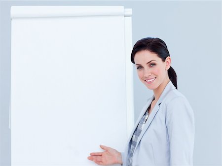 professionals whiteboard - Brunette businesswoman giving a presentation in a company Stock Photo - Budget Royalty-Free & Subscription, Code: 400-04188541