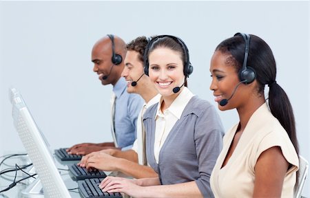 simsearch:400-04119293,k - Positive business partners with headset on working in a call center Fotografie stock - Microstock e Abbonamento, Codice: 400-04188590