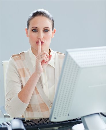 simsearch:400-04820733,k - Attractive businesswoman at a computer asking for silence in the office Stockbilder - Microstock & Abonnement, Bildnummer: 400-04188639