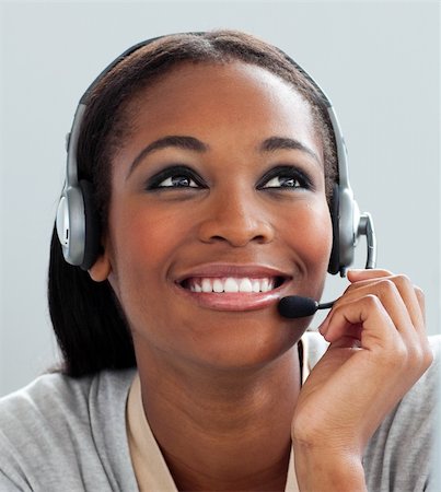 simsearch:400-03912315,k - Close-up of a customer service representative with headset on at her desk Photographie de stock - Aubaine LD & Abonnement, Code: 400-04188670