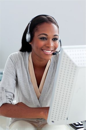 simsearch:400-03912315,k - Self-assured customer service representative with headset on at her desk Photographie de stock - Aubaine LD & Abonnement, Code: 400-04188673