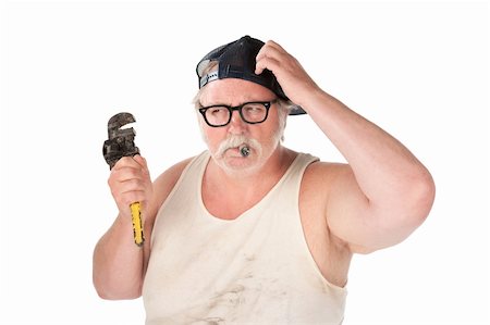 Puzzled plumber with pipe wrench and cigar Stock Photo - Budget Royalty-Free & Subscription, Code: 400-04188832