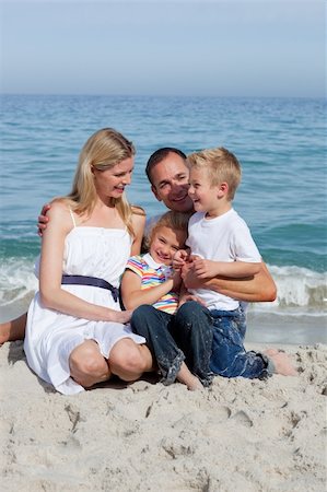 simsearch:400-05291156,k - Happy children and their parents sitting on the sand at the beach Stock Photo - Budget Royalty-Free & Subscription, Code: 400-04188968