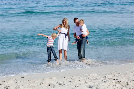 simsearch:400-04062793,k - Lively family having fun on the sand at the beach Photographie de stock - Aubaine LD & Abonnement, Code: 400-04188978
