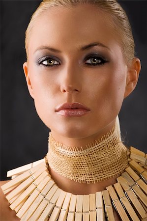 people of the amazon rainforest - closeup portrait of attractive blond woman like an amazon with a necklace made of wood peg Stock Photo - Budget Royalty-Free & Subscription, Code: 400-04180436