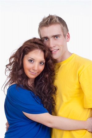 simsearch:400-04702706,k - happy young couple - boy embracing girl, smiling - isolated on white Stockbilder - Microstock & Abonnement, Bildnummer: 400-04180462