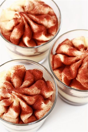 Three Tiramisu desserts in the cup Stock Photo - Budget Royalty-Free & Subscription, Code: 400-04180683