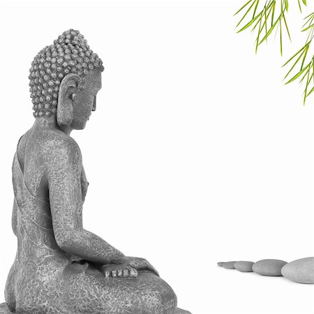 simsearch:400-04463989,k - Buddha face with eyes closed in prayer, sitting in the direction a line of grey stones and bamboo leaf grass,  isolated over white background. Mass produced statue. Stock Photo - Budget Royalty-Free & Subscription, Code: 400-04180792