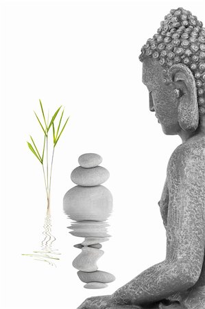 simsearch:400-05099216,k - Buddha in meditation abstract, with bamboo leaf grass and a line of grey stones, isolated over white background. Mass produced statue. Stock Photo - Budget Royalty-Free & Subscription, Code: 400-04180867