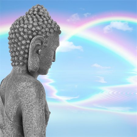 simsearch:400-05099216,k - Buddha with eyes closed in prayer, with a blue sky and double rainbow in reflection in the distance, symbolising nirvana.  Side view. Mass produced statue. Stock Photo - Budget Royalty-Free & Subscription, Code: 400-04181291