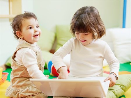 simsearch:400-04129482,k - female toddler and 2-3 years old girl playing with pc in kindergarten. Horizontal shape Photographie de stock - Aubaine LD & Abonnement, Code: 400-04181559