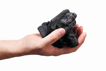 residue - Man holding lumps of charcoal in his hand Stock Photo - Budget Royalty-Free & Subscription, Code: 400-04181593