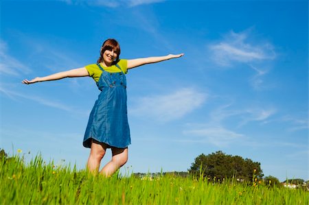 simsearch:400-04201795,k - Beautiful happy woman on a green meadow with arms open Fotografie stock - Microstock e Abbonamento, Codice: 400-04181978