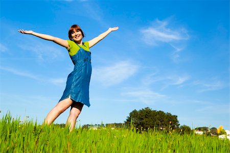 simsearch:400-04201795,k - Beautiful happy woman on a green meadow with arms open Fotografie stock - Microstock e Abbonamento, Codice: 400-04181980