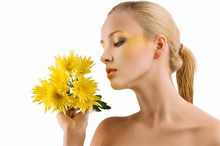 simsearch:400-06096871,k - profile shot of cute blond girl looking at some yellow flowers. wellness concept Stock Photo - Budget Royalty-Free & Subscription, Code: 400-04182053