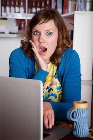 simsearch:400-04554624,k - Shocked lady in cafe with laptop on table Stock Photo - Budget Royalty-Free & Subscription, Code: 400-04182356