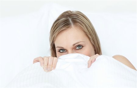 simsearch:400-04182849,k - Close-up of a woman hiding in her bed at home Stock Photo - Budget Royalty-Free & Subscription, Code: 400-04182852