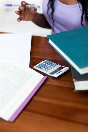 simsearch:400-04484714,k - Close-up of a student doing her homework at home Stock Photo - Budget Royalty-Free & Subscription, Code: 400-04182979