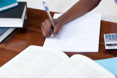 simsearch:400-05684311,k - Close-up of an Afro-American girl doing her homework at home Stock Photo - Budget Royalty-Free & Subscription, Code: 400-04182981