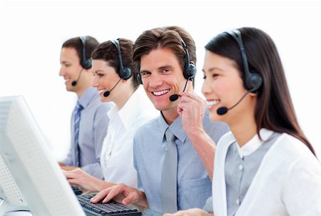 simsearch:400-04188205,k - Positive business people talking on headset in a call center Stock Photo - Budget Royalty-Free & Subscription, Code: 400-04183005