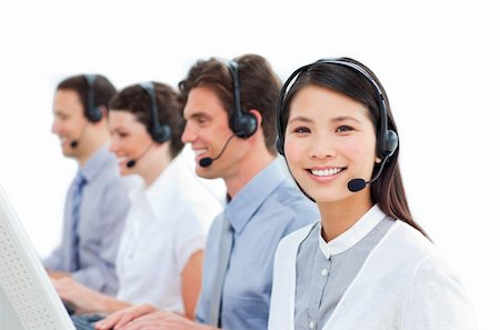 simsearch:400-04188205,k - Young business people talking on headset in a call center Stock Photo - Budget Royalty-Free & Subscription, Code: 400-04183003