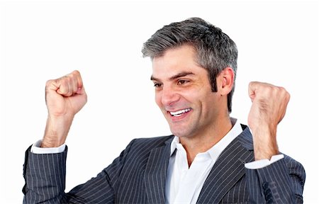 person punching for victory - Cheerful businessman punching the air in celebration against a white background Stock Photo - Budget Royalty-Free & Subscription, Code: 400-04183038