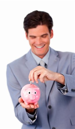 simsearch:400-05715051,k - Smiling businessman saving money in a piggy-bank against a white background Fotografie stock - Microstock e Abbonamento, Codice: 400-04183084