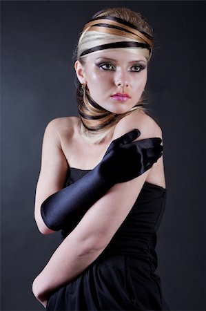 simsearch:400-08093594,k - Beautiful young Female modell wearing black hand glove in her right hand Foto de stock - Super Valor sin royalties y Suscripción, Código: 400-04183358