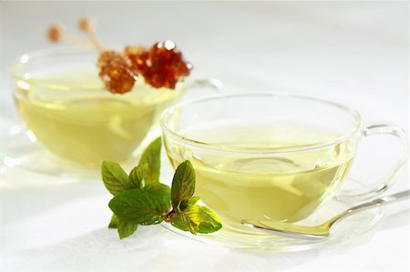 simsearch:400-06554630,k - Two cups of green herbal tea with sugar stick Stock Photo - Budget Royalty-Free & Subscription, Code: 400-04183391