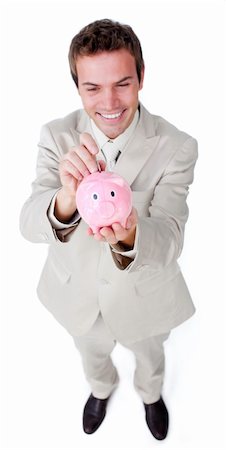 simsearch:400-05715051,k - Cheerful businessman saving money in a piggybank against a white background Fotografie stock - Microstock e Abbonamento, Codice: 400-04183755