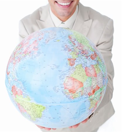 Close-up of a businessman holding a terrestrial globe isolated on a white background Stock Photo - Budget Royalty-Free & Subscription, Code: 400-04183757