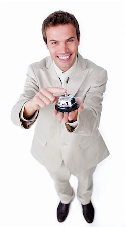 picture man at hotel desk checking in - Smiling confident businessman using a service bell isolated on a white background Stock Photo - Budget Royalty-Free & Subscription, Code: 400-04183759