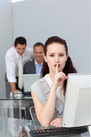 simsearch:400-04238180,k - Charming businesswoman asking for silence in the office Stockbilder - Microstock & Abonnement, Bildnummer: 400-04183924