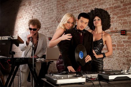 Handsome Asian DJ and Caucasian singer with ladies Stock Photo - Budget Royalty-Free & Subscription, Code: 400-04194132