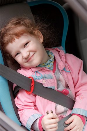 Cute little girl in a baby car seat Stock Photo - Budget Royalty-Free & Subscription, Code: 400-04194779