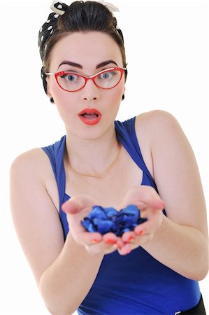 pretty young woman with red eyeglassess hold blue flower petals ins hands isolated on white Stock Photo - Budget Royalty-Free & Subscription, Code: 400-04195063