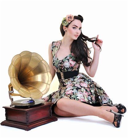 retro pin up girls - pretty girl listening music on old gramophone isolated on white in studio Photographie de stock - Aubaine LD & Abonnement, Code: 400-04195074