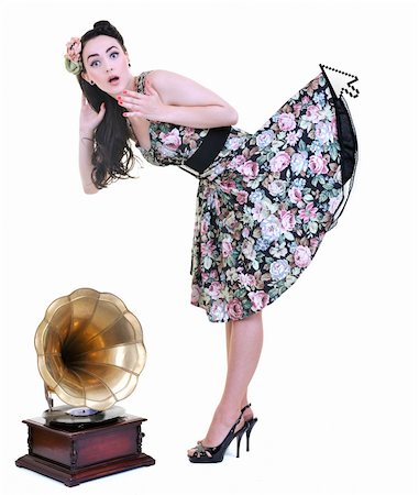 people holding vinyl records - mouse cursor hold in air prety skirt and dress of young beautiful woman isolated on white in studio Stock Photo - Budget Royalty-Free & Subscription, Code: 400-04195075