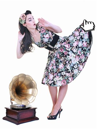 retro pin up girls - mouse cursor hold in air prety skirt and dress of young beautiful woman isolated on white in studio Photographie de stock - Aubaine LD & Abonnement, Code: 400-04195077