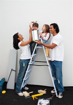 Happy family painting a room together Stock Photo - Budget Royalty-Free & Subscription, Code: 400-04195246